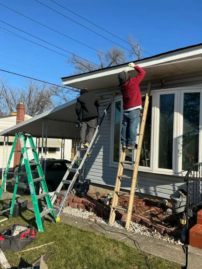 Restoration crew performing exterior repair in Highland Park