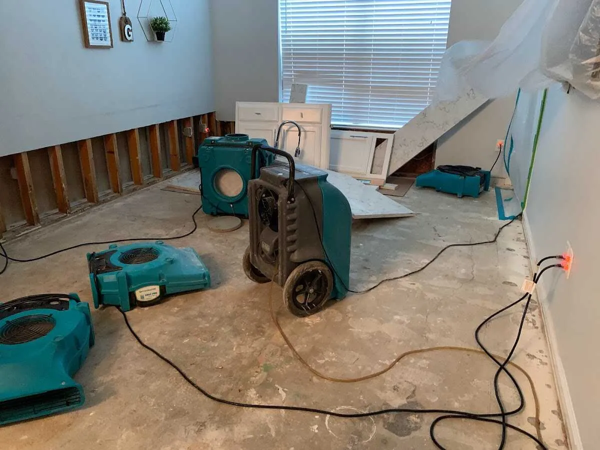 Dehumidifier in flood-cut room for Water Damage Restoration in Highland Park